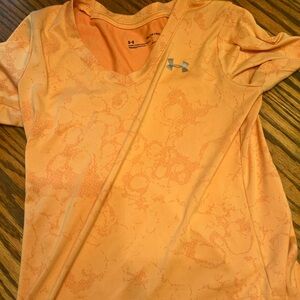 Women’s Under armour Dry Fit shirt. Orange brand new without tags